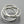 Load image into Gallery viewer, Three interlocking silver rings on a gray background