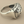 Load image into Gallery viewer, Silver ring with intricate design on a gray background
