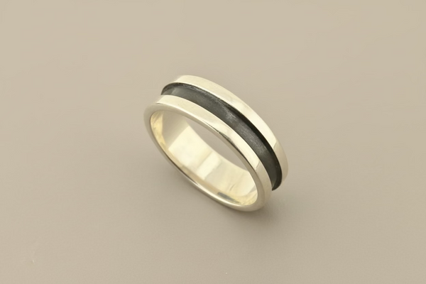 Silver band with wide oxidised groove