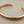 Load image into Gallery viewer, Rose gold bangle on a gray background
