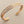Load image into Gallery viewer, Rose gold bracelet on a dark gray background
