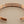 Load image into Gallery viewer, Rose gold bracelet on a dark gray background
