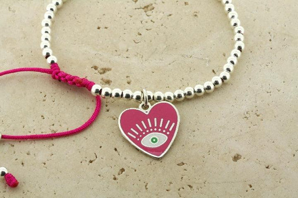 Enamelled pink flying heart bead bracelet - Makers & Providers