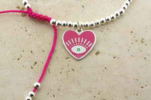 Enamelled pink flying heart bead bracelet - Makers & Providers