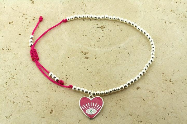 Enamelled pink flying heart bead bracelet - Makers & Providers