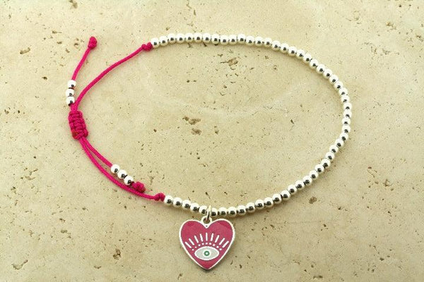 Enamelled pink flying heart bead bracelet