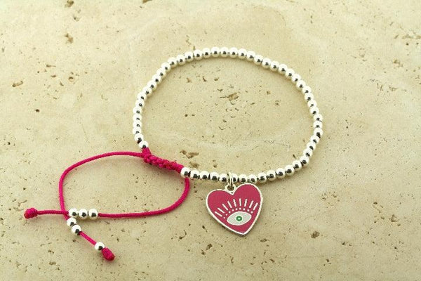 Enamelled pink flying heart bead bracelet