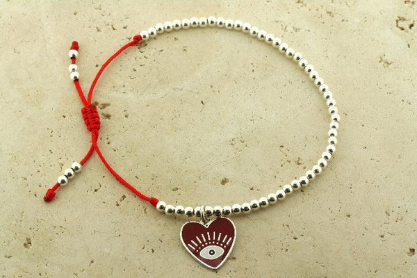 Enamelled red flying heart bead bracelet - Makers & Providers