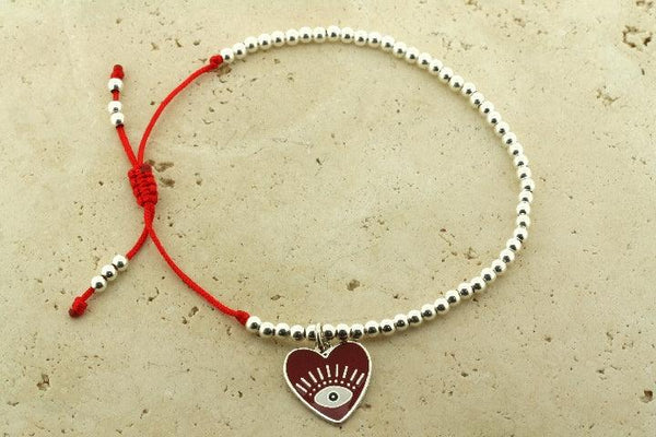 Enamelled red flying heart bead bracelet