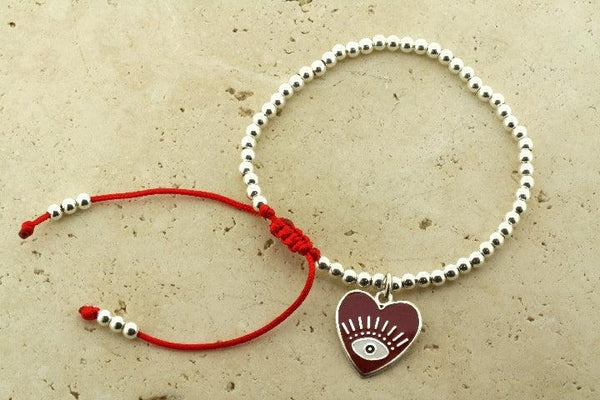 Enamelled red flying heart bead bracelet