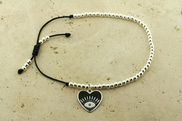 Enamelled black flying heart bead bracelet