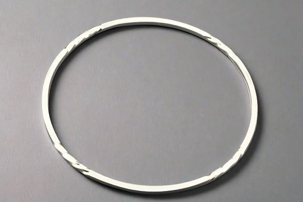 Silver ring on a gray background