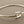 Load image into Gallery viewer, Silver bangle with a clasp on a gray background
