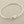 Load image into Gallery viewer, Silver bangle on a gray background
