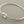 Load image into Gallery viewer, Silver bangle on a gray background

