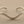Load image into Gallery viewer, Silver bracelet on a gray background
