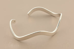 Silver cuff on a gray background