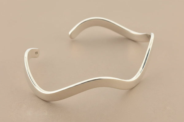 Silver cuff on a gray background