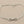 Load image into Gallery viewer, Silver infinity bracelet on a gray background
