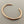 Load image into Gallery viewer, Rose gold bracelet on a gray background
