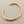 Load image into Gallery viewer, Rose gold bangle on a dark gray background
