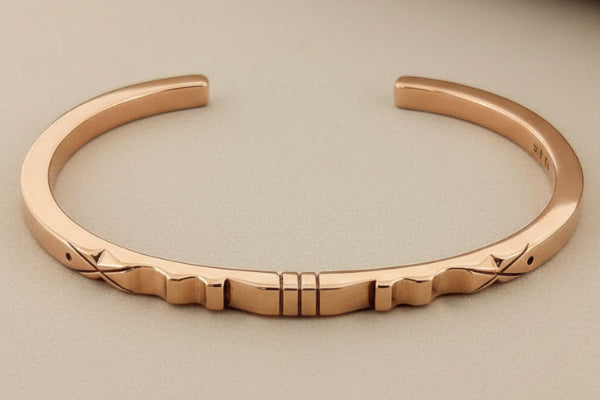 Copper bracelet on a gray background