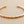 Load image into Gallery viewer, Rose gold bracelet on a gray background
