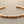 Load image into Gallery viewer, Rose gold bracelet on a gray background
