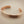 Load image into Gallery viewer, Bronze bangle on a gray background
