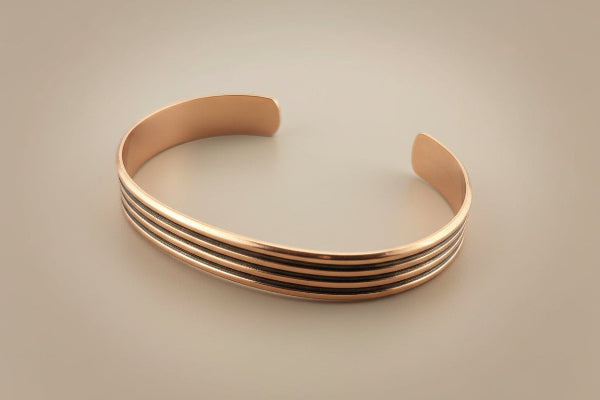 Bronze bangle on a gray background