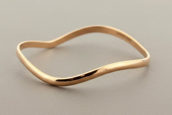 Buckled copper bangle