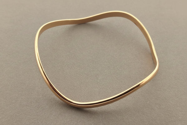Buckled copper bangle