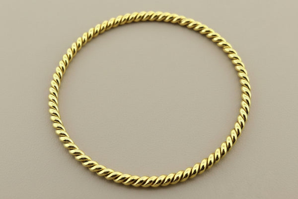 Twisted brass bangle