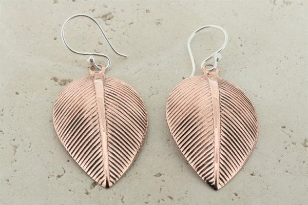 Detailed copper leaf earrings