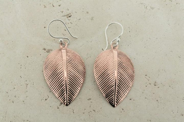 Detailed copper leaf earrings