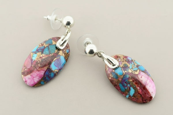Multicolored stone earrings on a gray background