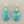 Load image into Gallery viewer, Turquoise earrings with silver hooks on a gray background
