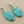 Load image into Gallery viewer, Turquoise stone earrings with silver hooks on a dark background
