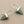 Load image into Gallery viewer, Pair of silver and turquoise triangle-shaped earrings on a gray background
