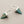Load image into Gallery viewer, Turquoise triangle earrings with silver accents on a gray background
