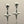 Load image into Gallery viewer, Silver skull and star-shaped earrings on a reflective surface with a neutral background
