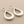 Load image into Gallery viewer, Pair of silver teardrop earrings on a gray background
