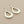 Load image into Gallery viewer, Pair of silver teardrop earrings on a gray background
