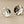 Load image into Gallery viewer, Pair of silver earrings with textured design on a gray background
