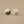 Load image into Gallery viewer, Pair of heart-shaped earrings on a gray background
