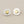 Load image into Gallery viewer, Pair of heart-shaped stud earrings on a gray background

