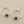 Load image into Gallery viewer, Silver hoop earrings on a gray background
