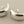 Load image into Gallery viewer, Pair of silver earrings on a gray background
