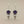 Load image into Gallery viewer, Pair of earrings with amethysts and pearls on a gray background
