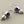 Load image into Gallery viewer, Pair of earrings with amethysts and pearls on a gray background
